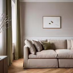 the sectional sofa is set in front of a window with curtains