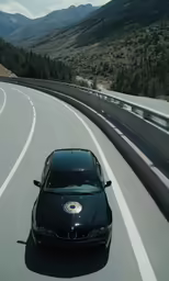 a car driving along the road with mountains behind it