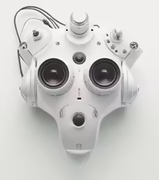 the back of a robotic head with speakers and lights on it