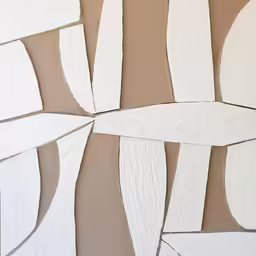 some paper pieces of white and brown colored