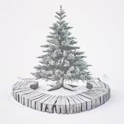 a small christmas tree sitting in the snow