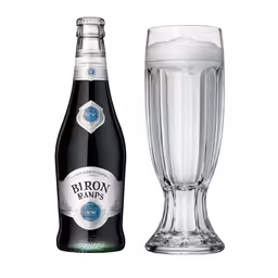 an empty bottle and glass filled with beer