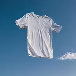 clothes hung up on a rope with a blue sky background