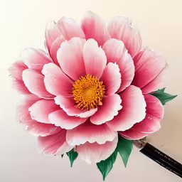 a pink flower sits atop the top of a brush