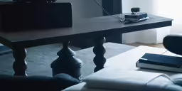 an upturned table has some books and a radio on it