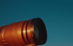 a man is taking pictures with a big lens