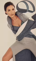 a young woman is posing for a magazine photo