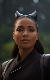 a black woman in devil ears and a black leather jacket