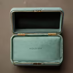 a small blue velvet case with the word semy written in gold