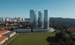 an aerial shot of buildings on the skyline with mountains in the background