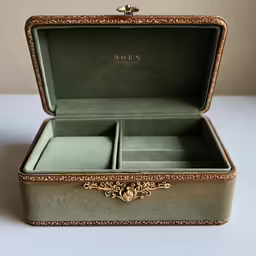 a vintage green velvet jewelry box with gold decoration