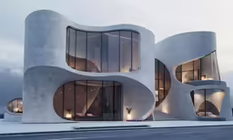 a building that has multiple windows and round pillars