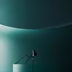 a lamp next to a green wall with a small chair