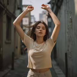 the woman is wearing a tan top and tan pants