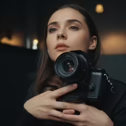 a young woman takes a photo with her camera