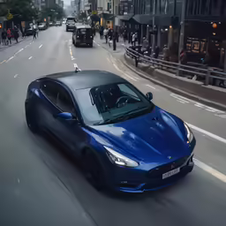 a large blue sports car driving down a street