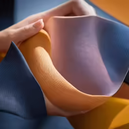 an orange and purple material that is bent out
