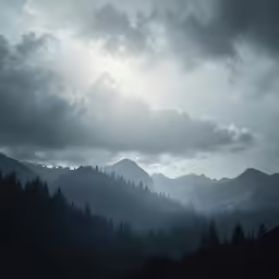 the sun is shining through the clouds above a mountainside