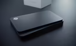 a close up of a black business card on a desk