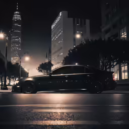 car on a city street in the dark