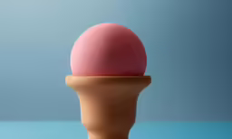a cone filled with an ice cream sitting on top of a table