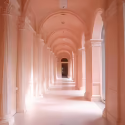 there is a long hallway leading to many smaller rooms