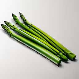 four stalks of celery laying on a white table