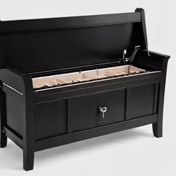 an open box containing jewelry sits on a white surface