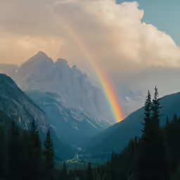 a mountain is shown with a rainbow