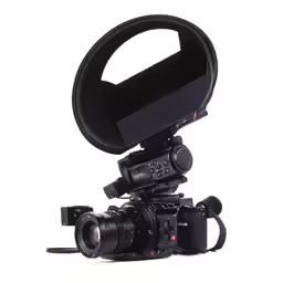 a camera on a tripod, with a video microphone attached