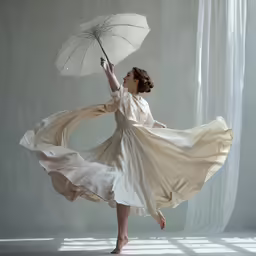 the woman in the dress holds an umbrella