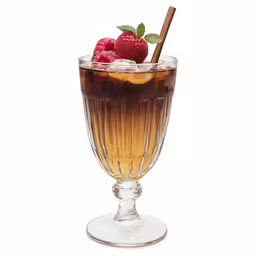 a glass filled with liquid and a straw and some raspberries