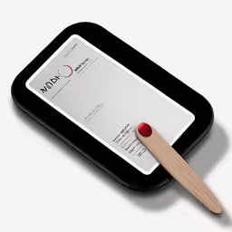 a close up of a fake tooth on a card