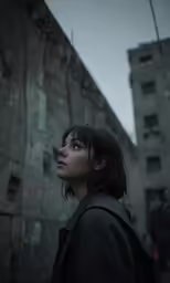 a young girl standing next to a building