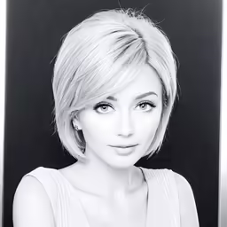 a woman posing for a black and white photo