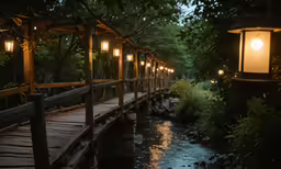 a bridge that has lights over water on it