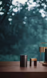 a teapot with three tea cups on a table