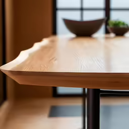 a modern wooden table with a bowl on it