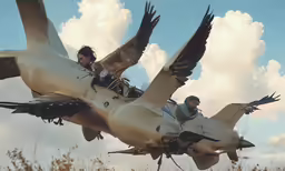 a couple are riding in an old airplane