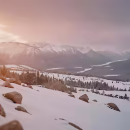 an outdoor snowboarder is coming down the slopes