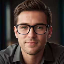 a close up of a man wearing glasses