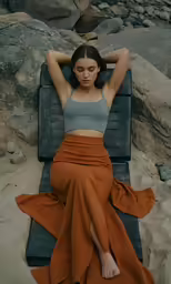 there is a female sitting on a chair
