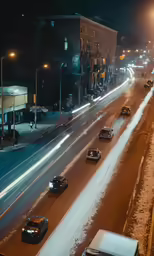 cars driving down the road in heavy snow