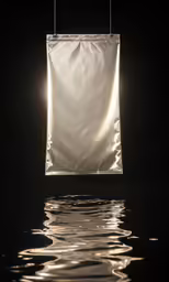 a square hanging item with reflections on the surface