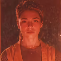 the woman wearing an apron stands in front of an old fashioned camera