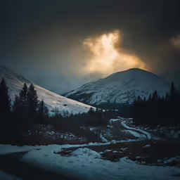 dark and stormy weather looms over the mountains
