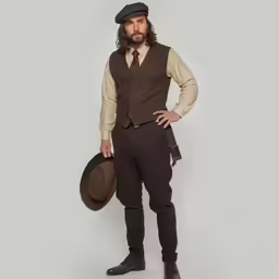 a man wearing a brown suit and hat with long hair standing in front of a white background
