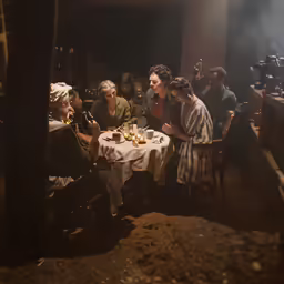 a group of women sitting around a table