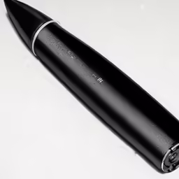 a pen is laying on top of a table