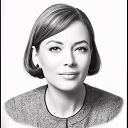 a black and white photo of a woman wearing pearls